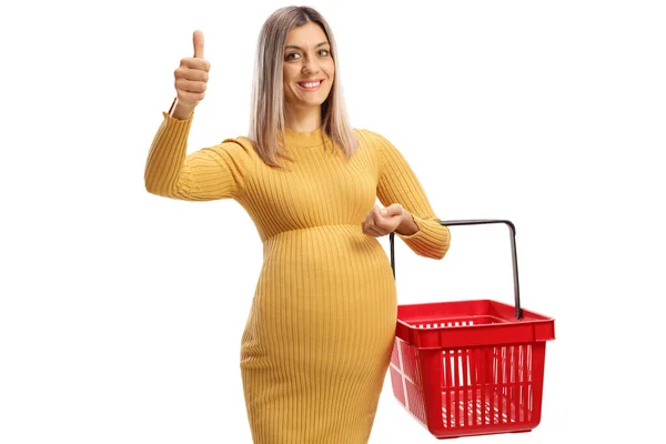 Mujer Embarazada Sonriente Sosteniendo Una Cesta Compra Mostrando Los Pulgares — Foto de Stock