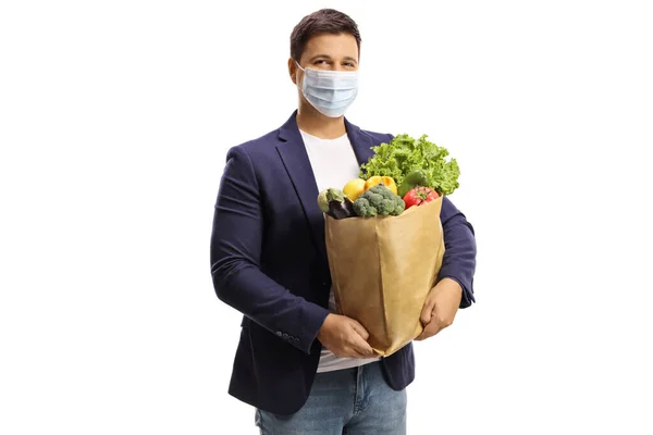 Jongeman Met Een Boodschappentas Met Een Beschermend Gezichtsmasker Geïsoleerd Witte — Stockfoto