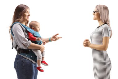 Profile shot of a mother with a baby talking to a young woman isolated on white background
