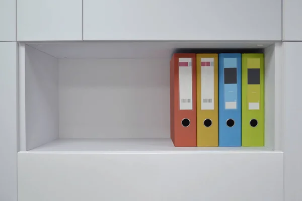 Office folders for documents on the shelf