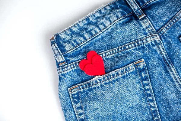 Jeans on a white background. Pocket. A heart. Valentine\'s Day. Love.