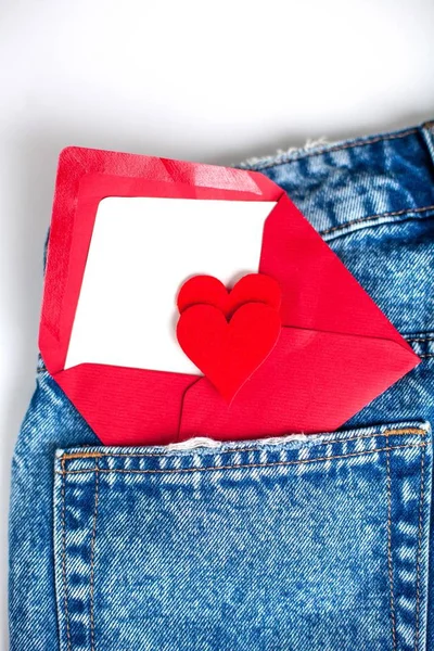 Jeans on a white background. Pocket. A heart. Valentine\'s Day. Love.