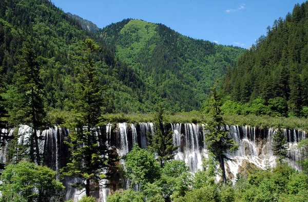 Juizhaigou (Nine Villages Valley) in Sichuan, China. View of Nuorilang Waterfall. Juizhaigou is a popular tourist destination in China famous for its waterfalls, lakes and scenic beauty.