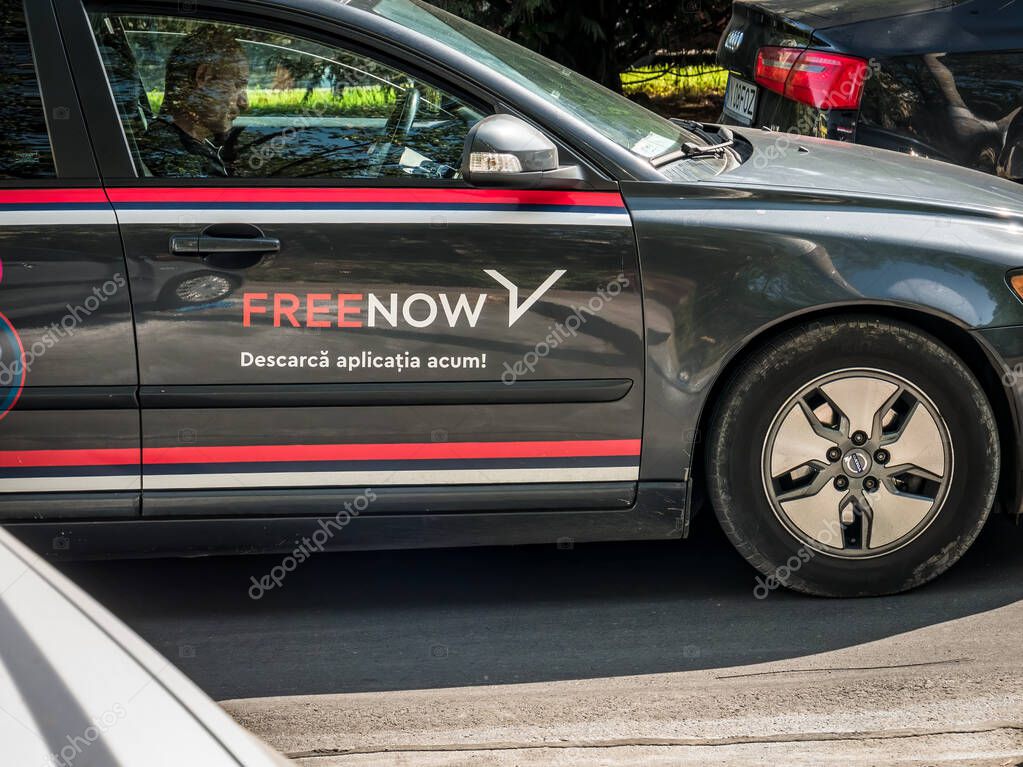 Bucharest/Romania 09.05.2020: Logo of the ride-hailing german transportation platform FreeNow printed on a black car.