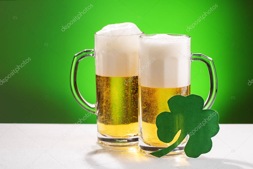 Two mugs of beer. Concept for St. Patricks day.