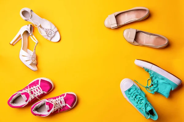 Collection of womens shoes on yellow background — Stock Photo, Image