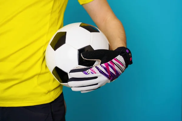 Man is socccer fan in yellow t-shirt with soccer ball — Stock Photo, Image