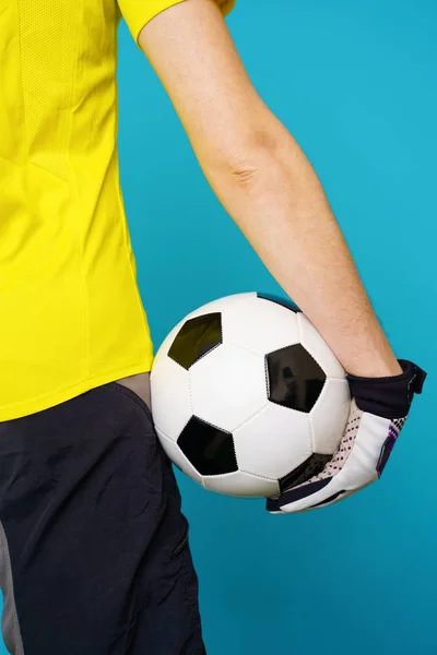 Man is socccer fan in yellow t-shirt with soccer ball — Stock Photo, Image