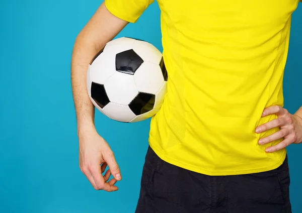 Man is socccer fan in yellow t-shirt with soccer ball — Stock Photo, Image