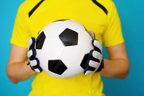 Man is socccer fan in yellow t-shirt with soccer ball — Stock Photo, Image