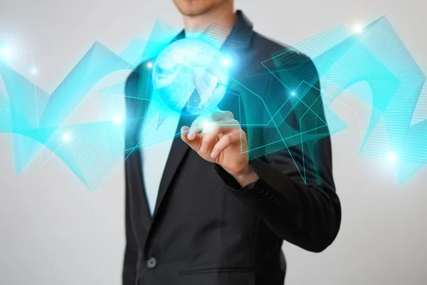 Businessman holding the glowing hologram digital globe. Concepr of business and innovation — Stock Photo, Image