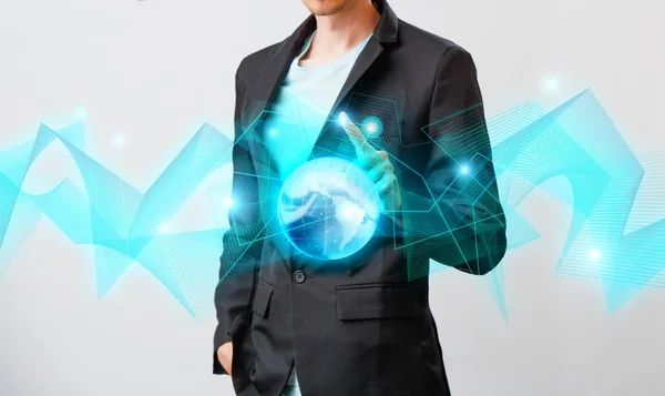 Businessman holding the glowing hologram digital globe. Concepr of business and innovation — Stock Photo, Image