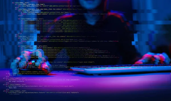 Hacker working with computer in dark room with digital interface around. Image with glitch effect. — Stock Photo, Image