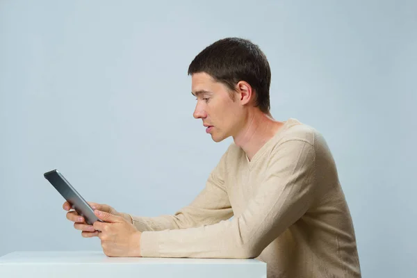 Man is using tablet computer for communication in chat or video chat. Social media concept. — Stock Photo, Image