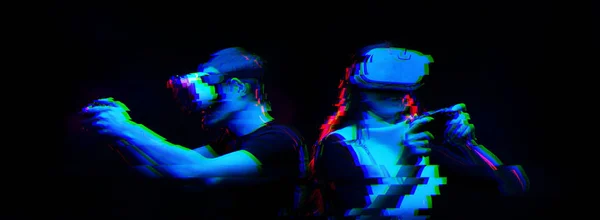 Couple with virtual reality headset are playing game. Image with glitch effect. — Stock Photo, Image