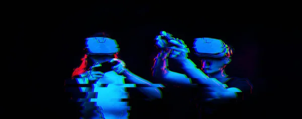 Couple with virtual reality headset are playing game. Image with glitch effect. — Stock Photo, Image