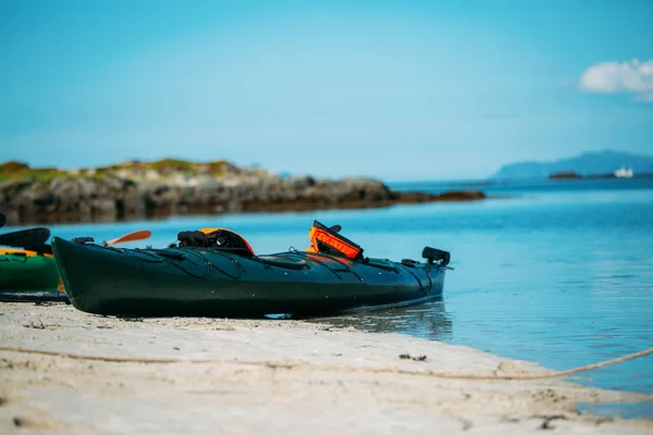 Photo of kayak on sandy seashore, blue sky in Norway on summer. — Stock Photo, Image