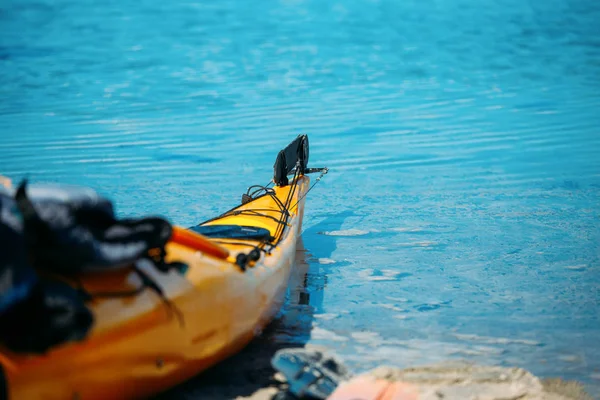 Photo of orange kayak on blue sea in Norway on summer — Stock Photo, Image