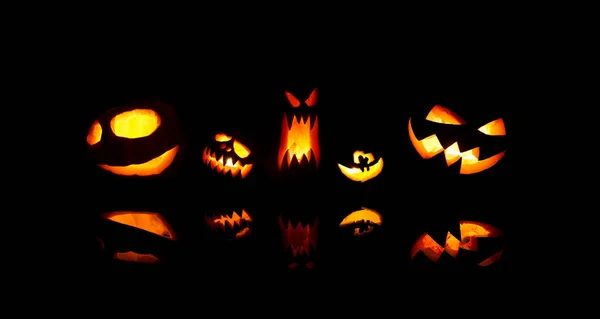 Image of halloween pumpkins with burning mouths on blank black background. — Stock Photo, Image