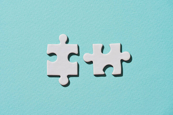 Two connecting puzzle piece.