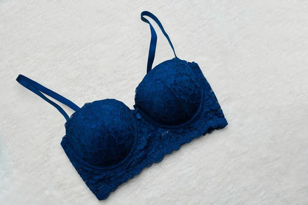 Dark blue female bra in underwear store. — Stock Photo, Image