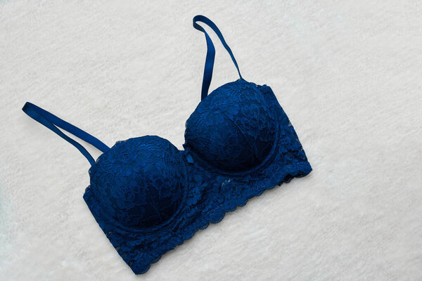 Dark blue female bra in underwear store.