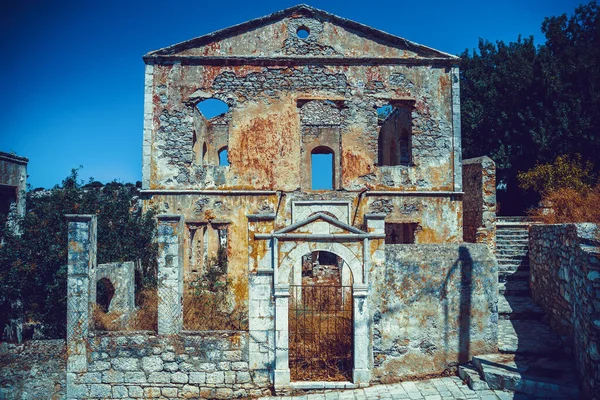 Old building ruins from white stone on the Greek island of Symi, Dodecanese, Greece