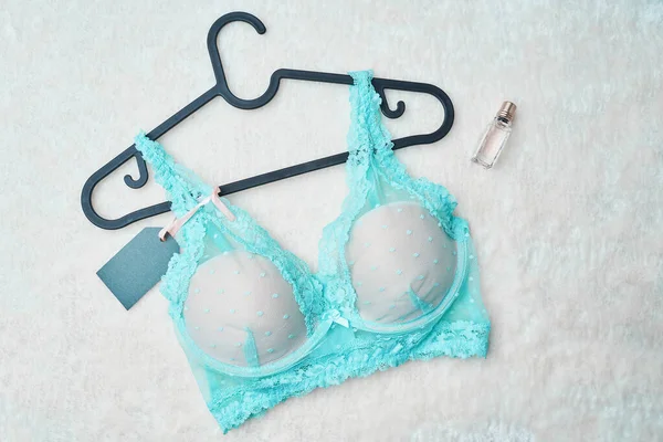 Turquoise female bra in underwear store. — Stock Photo, Image