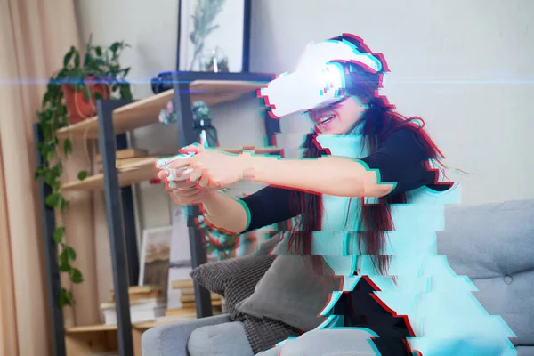 Woman with virtual reality headset is playing game. Image with glitch effect. — Stock Photo, Image