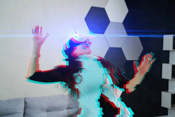 Woman is using virtual reality headset. Image with glitch effect.