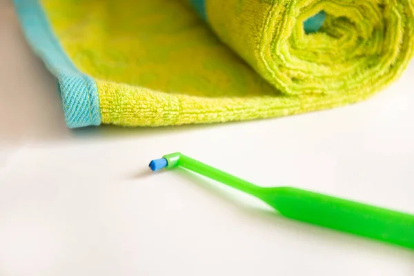 Green toothbrush with a one tuft for braces on a table — Stock Photo, Image