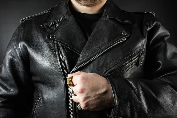 Man in leather biker jacket closeup.
