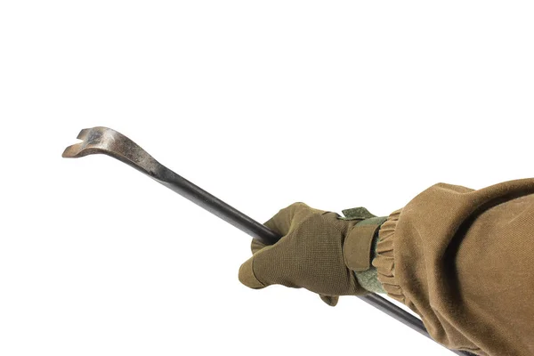 Braço de soldado segurando pé de cabra de metal . — Fotografia de Stock