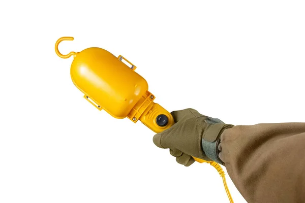 Arm mit gelber tragbarer Lampe. — Stockfoto