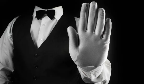 Waiter showing hand palm in white glove.
