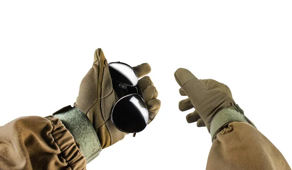 Soldier arms holding black sunglasses. — Stock Photo, Image
