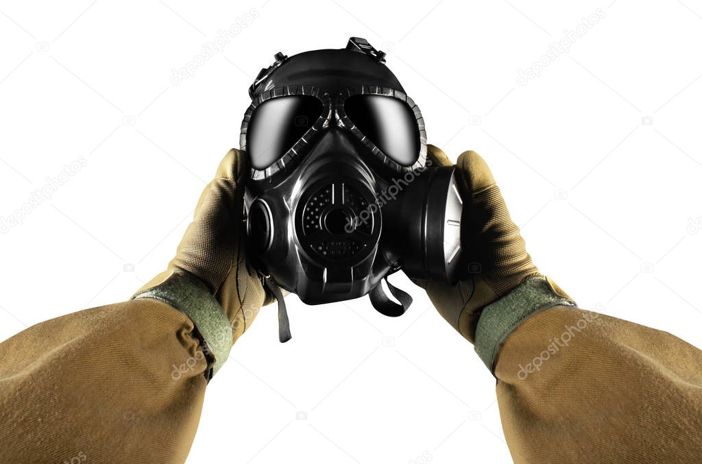 Isolated first person view military hands holding gas mask.