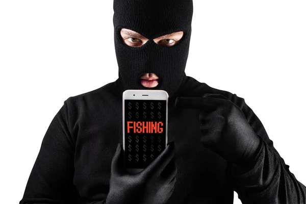 Ladrón masculino en máscara y guantes sosteniendo teléfono inteligente . —  Fotos de Stock