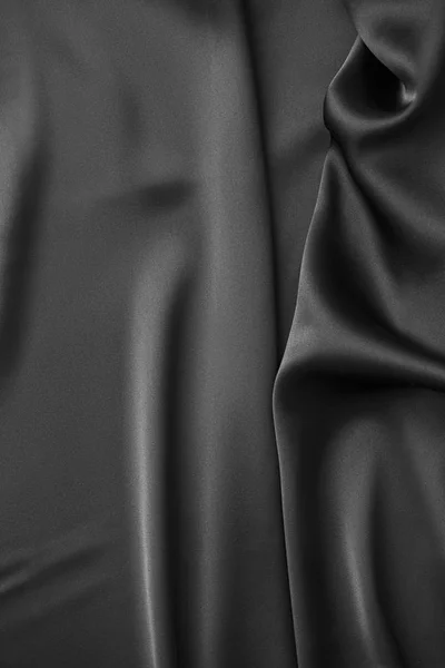 Zwarte luxe golvende golfde glanzende zijde draperie doek stof — Stockfoto