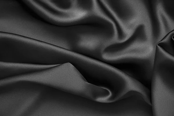 Черная роскошная волнистая волнистая шелковая ткань — стоковое фото