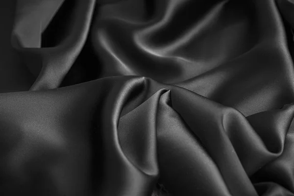 Tessuto di tela di seta lucida ondulata ondulata lusso nero drappeggio — Foto Stock