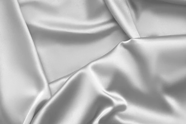 Ondas de pano de cetim tecido de seda branco ondulado fundo — Fotografia de Stock