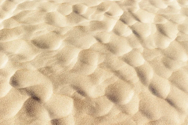 Dokulu kumlu yüzey, doğal desenli ve güneşli gölgeler..