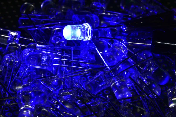 Low-power blue semiconductor LEDs in transparent plastic housing. Demonstration of the classic indicator for electronic systems.
