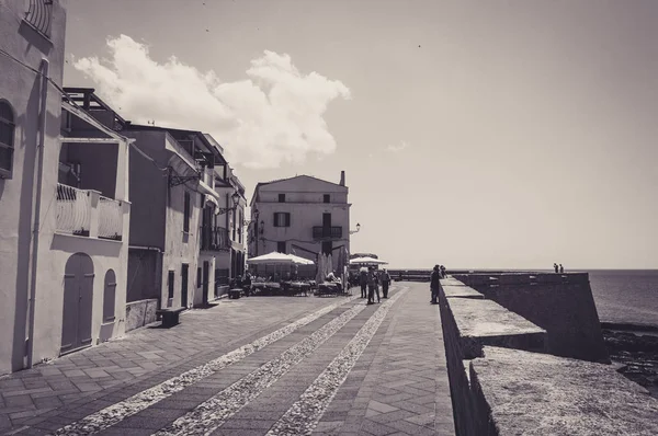 pedestrian area on the ramparts of Alghero - Sardinia in a sunny day of spring in black and white