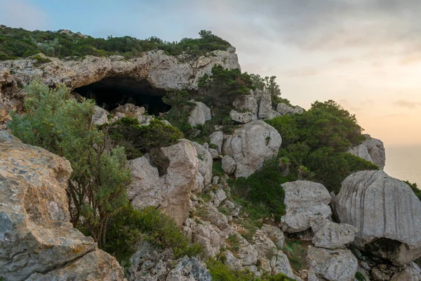 cave of broken vessels, in the sardinian coast, at sunset