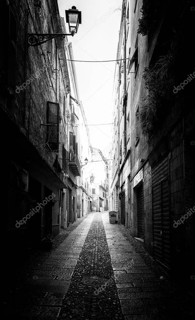 Beautiful deserted alley in a italian old city in black and white