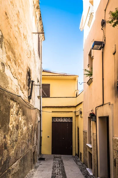 Beautiful deserted alley in a italian old city in a sunny day