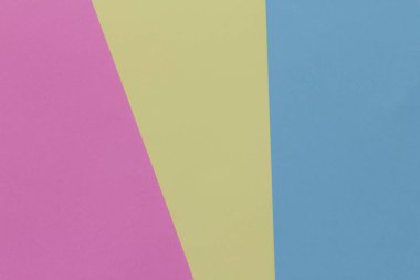 Yaratıcı geometrik Kağıt arka plan. Pembe, mavi, sarı pastel renkler. Soyutlama. Şablon. Üstten görünüm.