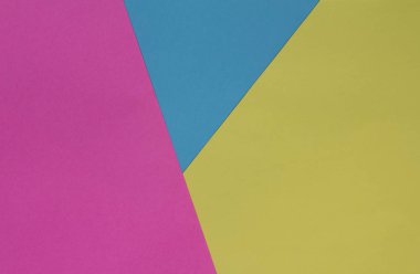 Yaratıcı geometrik Kağıt arka plan. Pembe, mavi, sarı renkler. Soyutlama. Şablon. Üstten görünüm.